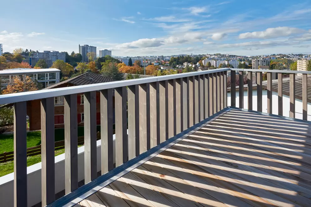Quels sont les avantages de la surélévation bois des bâtiments: explication et présentation d'exemples par LUTZ architectes, le spécialiste romand de la surélévation en bois