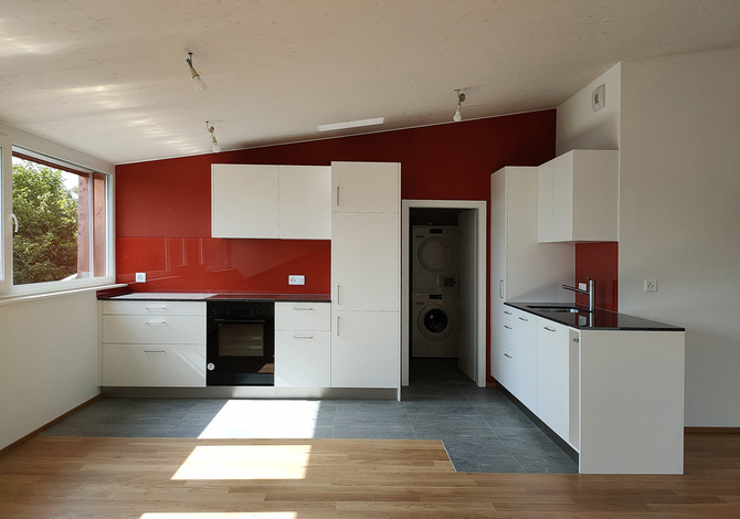 Rénovation d'un petit immeuble des années 50 à Fribourg avec agrandissement bois