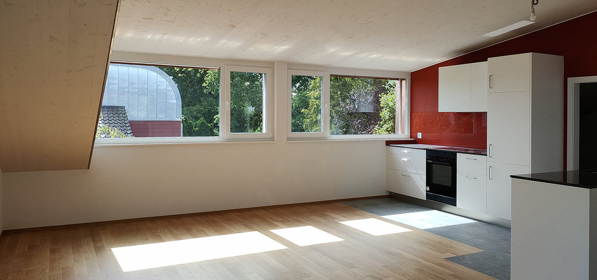 Rénovation d'un petit immeuble des années 50 à Fribourg avec agrandissement bois