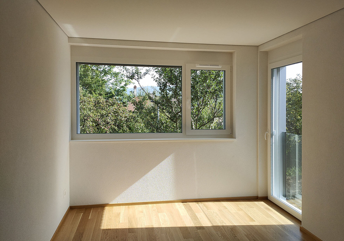 Rénovation d'un petit immeuble des années 50 à Fribourg avec agrandissement bois