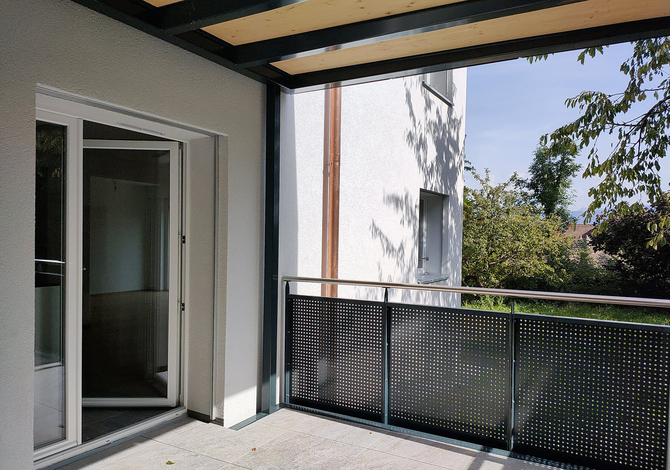 Rénovation d'un petit immeuble des années 50 à Fribourg avec agrandissement bois