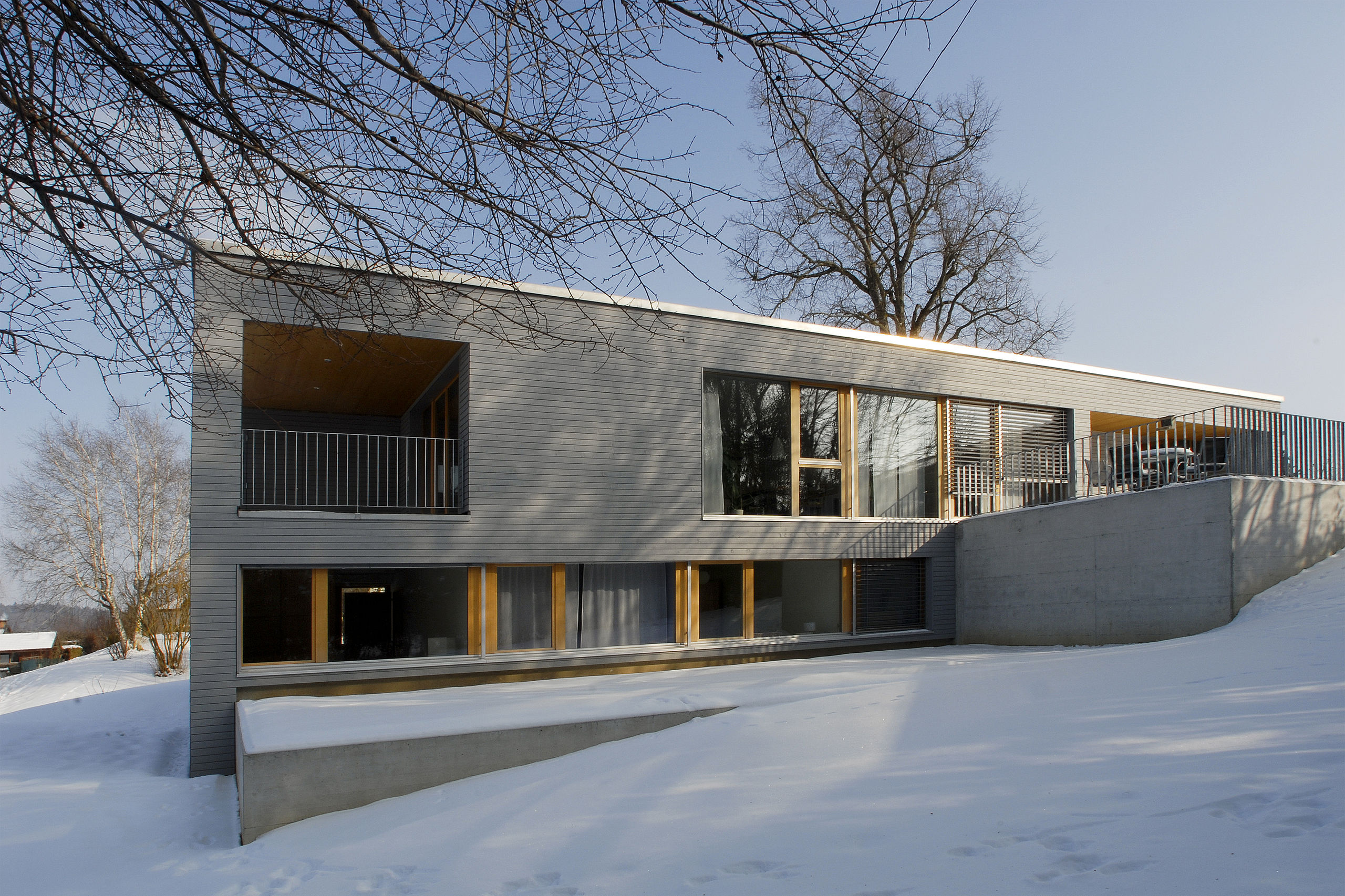 Maison bois à ossature bois contemporaine Minergie à Fribourg